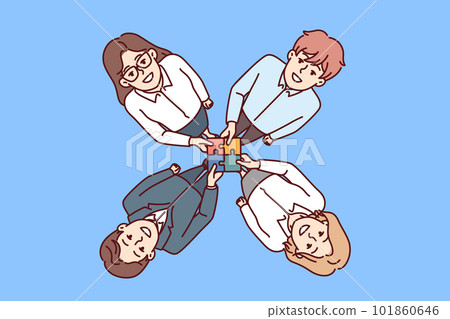 Friendly business people hold together puzzle symbolizing consolidation and synergy 101860646
