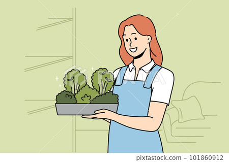 Smiling woman with microgreen container in hands Smiling woman with microgreen container in hands 101860912