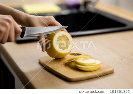 woman cuts lemon 101861895