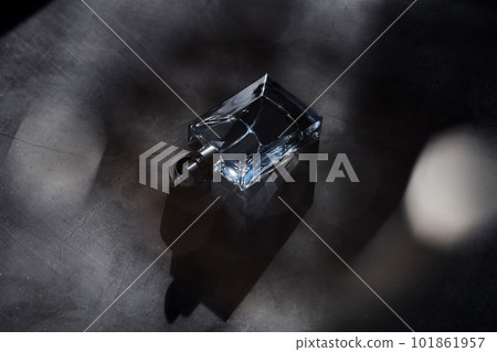 Bottle of essence perfume on dark background 101861957