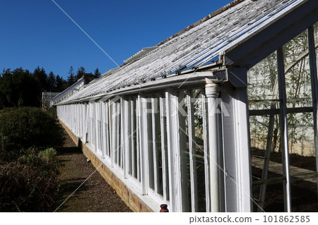 Old Victorian Greenhouse Structure in a Country Estate Garden Old Victorian Greenhouse Structure in a Country Estate Garden 101862585