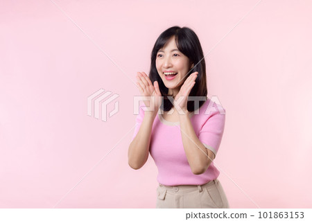 Portrait beautiful young asian woman expression yel scream announce news of communication message or shout loud voice with hand beside mouth gesture isolated on pink pastel background. Portrait beautiful young asian woman expression yel scream announce news of communication message or shout loud voice with hand beside mouth gesture isolated on pink pastel background. 101863153