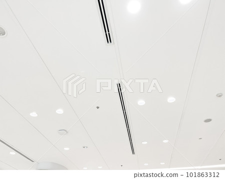 Ceiling mounted cassette type air conditioner and modern lamp light on white ceiling. duct air conditioner for home or office 101863312