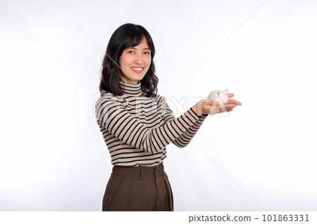 Portrait of young Asian woman casual uniform holding white piggy bank isolated on white background, Financial and bank saving money concept Portrait of young Asian woman casual uniform holding white piggy bank isolated on white background, Financial and bank saving money concept 101863331