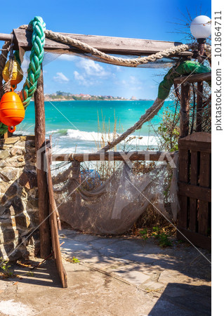 Nautical style hanging decoration and sea view Nautical style hanging decoration and sea view 101864711