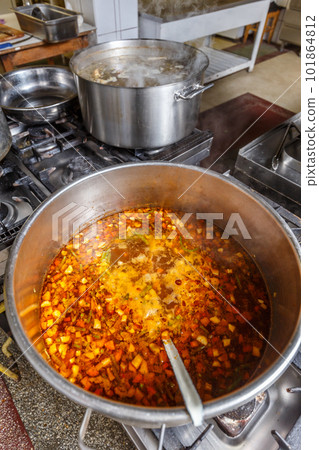Several pots cooking on hotplate 101864812