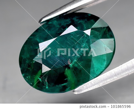 Natural gemstone green dioptase on a gray background 101865596