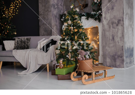 New Year's room interior decor, beautiful Christmas tree and fireplace in the background 101865628
