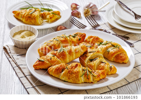 savory crescent rolls with melted cheese filling 101866193