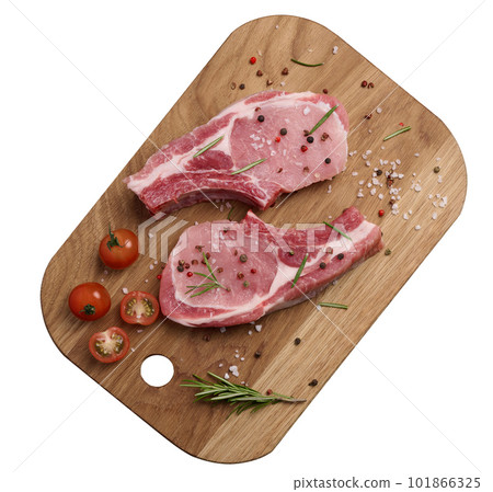 Raw pork tenderloin on the bone and spices on a wooden cutting board on a white isolated background. Portion for lunch and dinner, top view 101866325