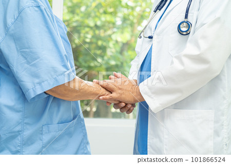 Caregiver holding hands Asian elderly woman patient with love, care, encourage and empathy at nursing hospital, healthy strong medical concept. 101866524
