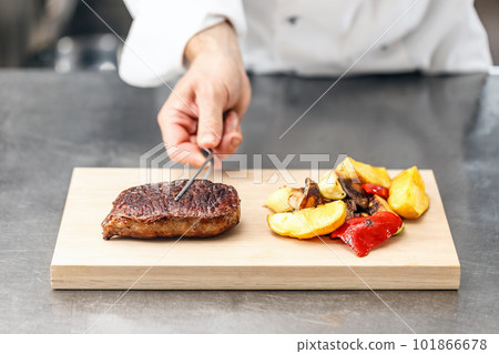 Chef served beef steak 101866678