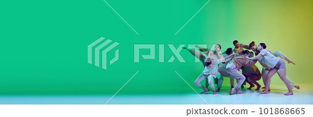 Banner with dance team of young adorable girls moving to the beat of the music on green gradient background in neon light. Copy space for ad, text Banner with dance team of young adorable girls moving to the beat of the music on green gradient background in neon light. Copy space for ad, text 101868665