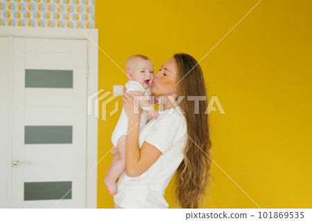 Mother and baby kissing and hugging. Happy family Mother and baby kissing and hugging. Happy family 101869535