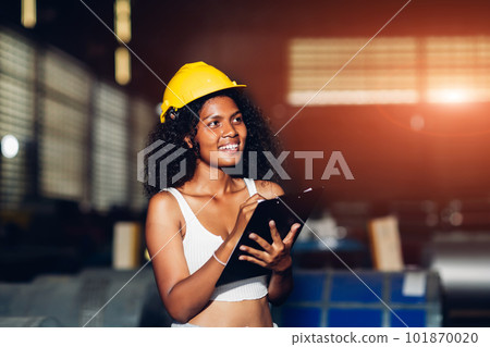 Foreman or worker work at factory site check up machine or products in site 101870020