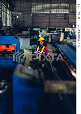 Foreman or worker work at factory site check up machine or products in site 101870031