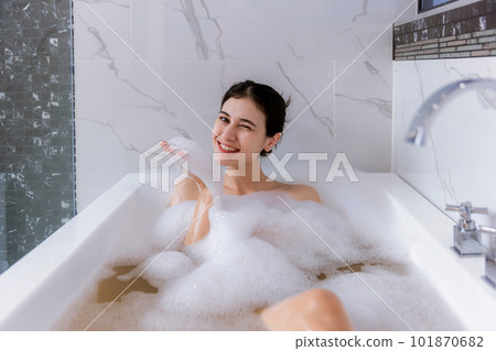 Relaxed woman laying in bathtub. enjoyment concept. Relaxed woman laying in bathtub. enjoyment concept. 101870682