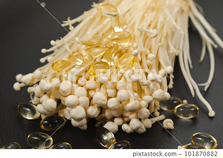 Mushroom or enoki close up, useful and medicinal properties of Asian mushrooms. Mushroom or enoki close up, useful and medicinal properties of Asian mushrooms. 101870882