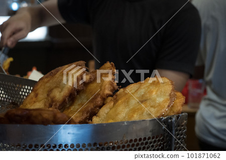 The fried cempedak which is the fruit similar with jackfruit but with strong smell and softer. Covered with flour. The fried cempedak which is the fruit similar with jackfruit but with strong smell and softer. Covered with flour. 101871062