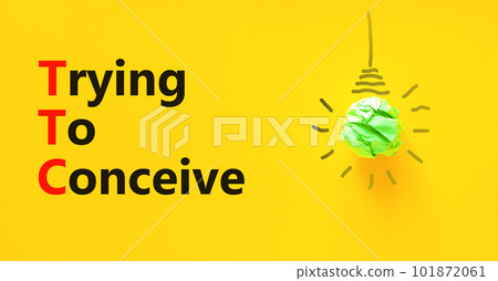 TTC trying to conceive symbol. Concept words TTC trying to conceive on yellow paper on a beautiful yellow background. Green light bulb icon. Medical and TTC trying to conceive concept. Copy space. TTC trying to conceive symbol. Concept words TTC trying to conceive on yellow paper on a beautiful yellow background. Green light bulb icon. Medical and TTC trying to conceive concept. Copy space. 101872061