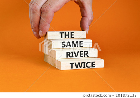 The same river twice symbol. Concept words The same river twice on wooden block. Beautiful orange table orange background. Motivational business the same river twice concept. Copy space. The same river twice symbol. Concept words The same river twice on wooden block. Beautiful orange table orange background. Motivational business the same river twice concept. Copy space. 101872132