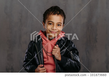 Portrait of little multiracial boy with leather jacket. Portrait of little multiracial boy with leather jacket. 101873660