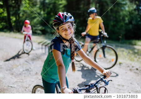 Young family with little children at bike trip together in nature. Young family with little children at bike trip together in nature. 101873803