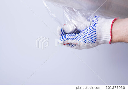 Packing the goods in a cardboard box and stretch film. Tools for packing parcels at the post office. 101873930