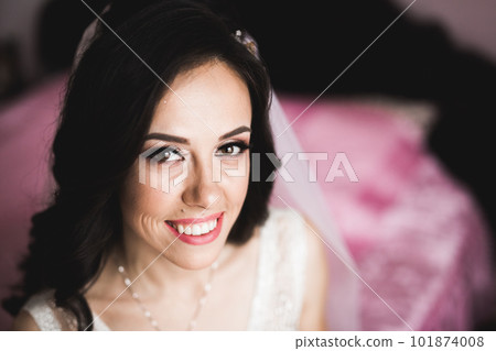 Beautiful fashion bride in wedding dress posing Beautiful fashion bride in wedding dress posing 101874008