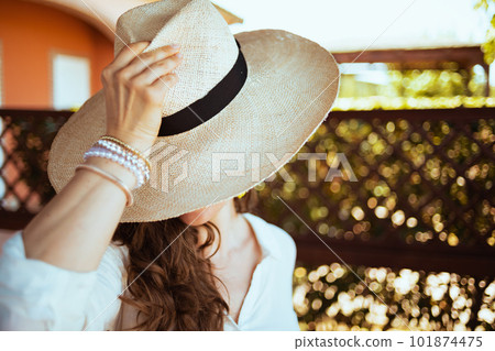 elegant female in white shirt with hat 101874475