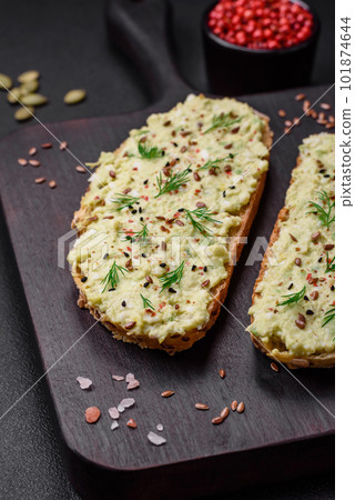 Grilled toast with avocado paste, eggs, cream cheese, salt, spices and herbs Grilled toast with avocado paste, eggs, cream cheese, salt, spices and herbs 101874644