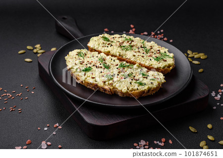 Grilled toast with avocado paste, eggs, cream cheese, salt, spices and herbs Grilled toast with avocado paste, eggs, cream cheese, salt, spices and herbs 101874651