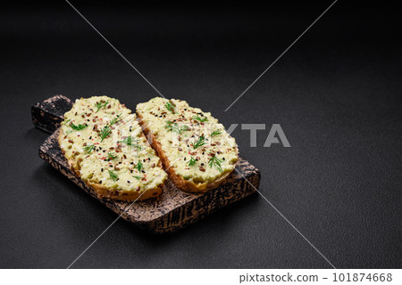 Grilled toast with avocado paste, eggs, cream cheese, salt, spices and herbs Grilled toast with avocado paste, eggs, cream cheese, salt, spices and herbs 101874668