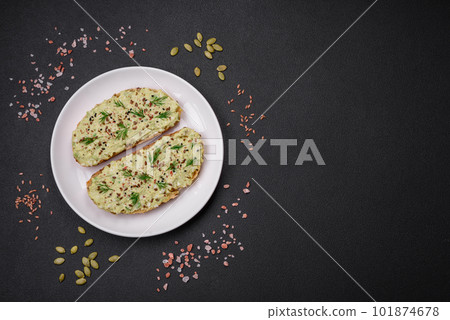 Grilled toast with avocado paste, eggs, cream cheese, salt, spices and herbs 101874678