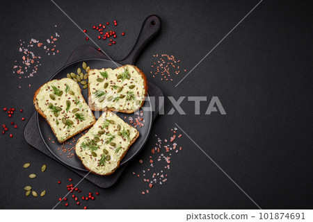 Grilled toast with avocado paste, eggs, cream cheese, salt, spices and herbs Grilled toast with avocado paste, eggs, cream cheese, salt, spices and herbs 101874691