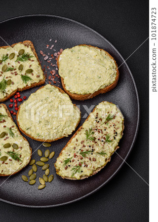 Grilled toast with avocado paste, eggs, cream cheese, salt, spices and herbs Grilled toast with avocado paste, eggs, cream cheese, salt, spices and herbs 101874723