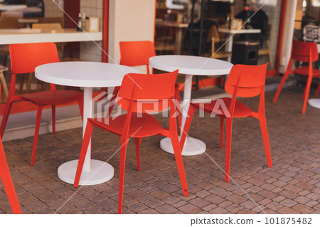 Cafe table and chairs on urban street - summer restaurant and coffee shop outdoor concept Cafe table and chairs on urban street - summer restaurant and coffee shop outdoor concept 101875482
