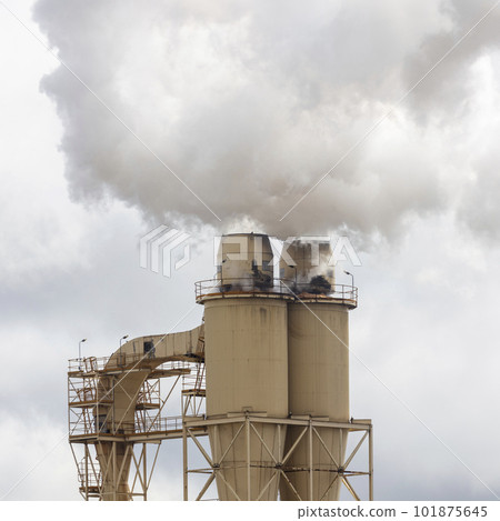 Photograph of steam coming from an industrial chimney Photograph of steam coming from an industrial chimney 101875645