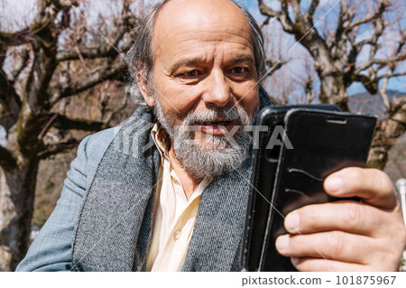 Portrait of a confident, handsome, mature man, pensioner, grandfather in the small town 101875967
