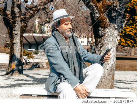 Portrait of a confident, handsome, mature man, pensioner, grandfather in the small town Portrait of a confident, handsome, mature man, pensioner, grandfather in the small town 101875974