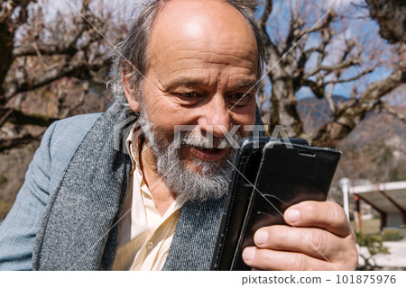 Portrait of a confident, handsome, mature man, pensioner, grandfather in the small town Portrait of a confident, handsome, mature man, pensioner, grandfather in the small town 101875976