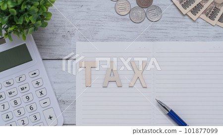 TAX (tax) image | White wood grain background, notebook and calculator TAX (tax) image | White wood grain background, notebook and calculator 101877099