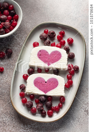 delicious ice cream with berry filling in ceramic plate. Summer refreshing ice cream dessert. vertical image delicious ice cream with berry filling in ceramic plate. Summer refreshing ice cream dessert. vertical image 101878684