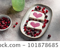 vanilla ice cream with berry heart filling in middle and chia seeds water in bottle. Summer food concept 101878685
