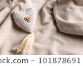 Mothers day background with soft beige heart on fabric backdrop. Symbol of love. soft focus. close-up 101878691