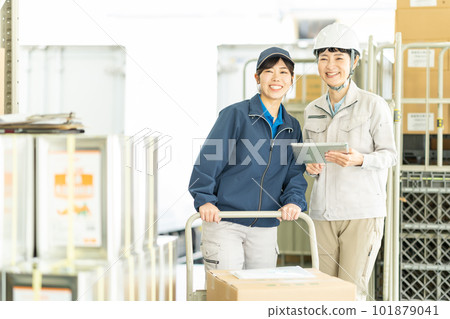 Female driver and worker working in warehouse Female driver and worker working in warehouse 101879041