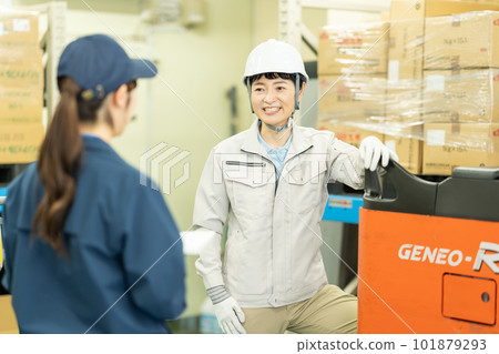 Female driver and worker working in warehouse 101879293