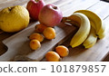 Assorted fruit on a wooden table 101879857