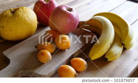 Assorted fruit on a wooden table 101879857