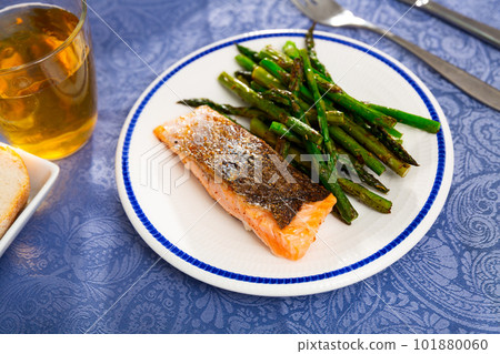 Sliced tasty salmon with asparagus Sliced tasty salmon with asparagus 101880060